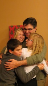 2012 Christmas 2012 dad hugging 3 kids
