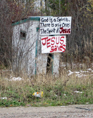 christian sign on outhouse