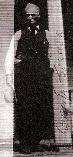 Nelson Jesmer standing on porch 1920s