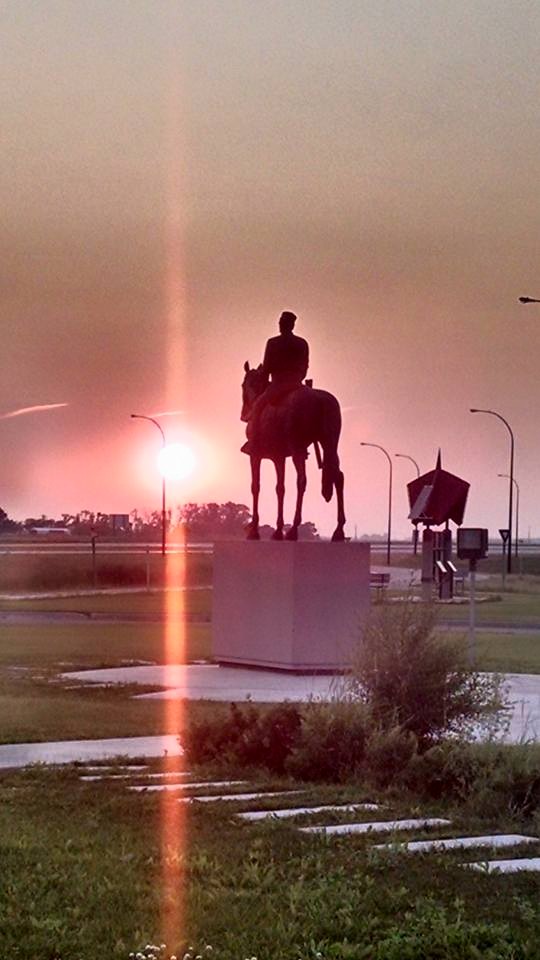 statue into the sunset