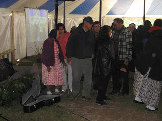 adults at tent meeting